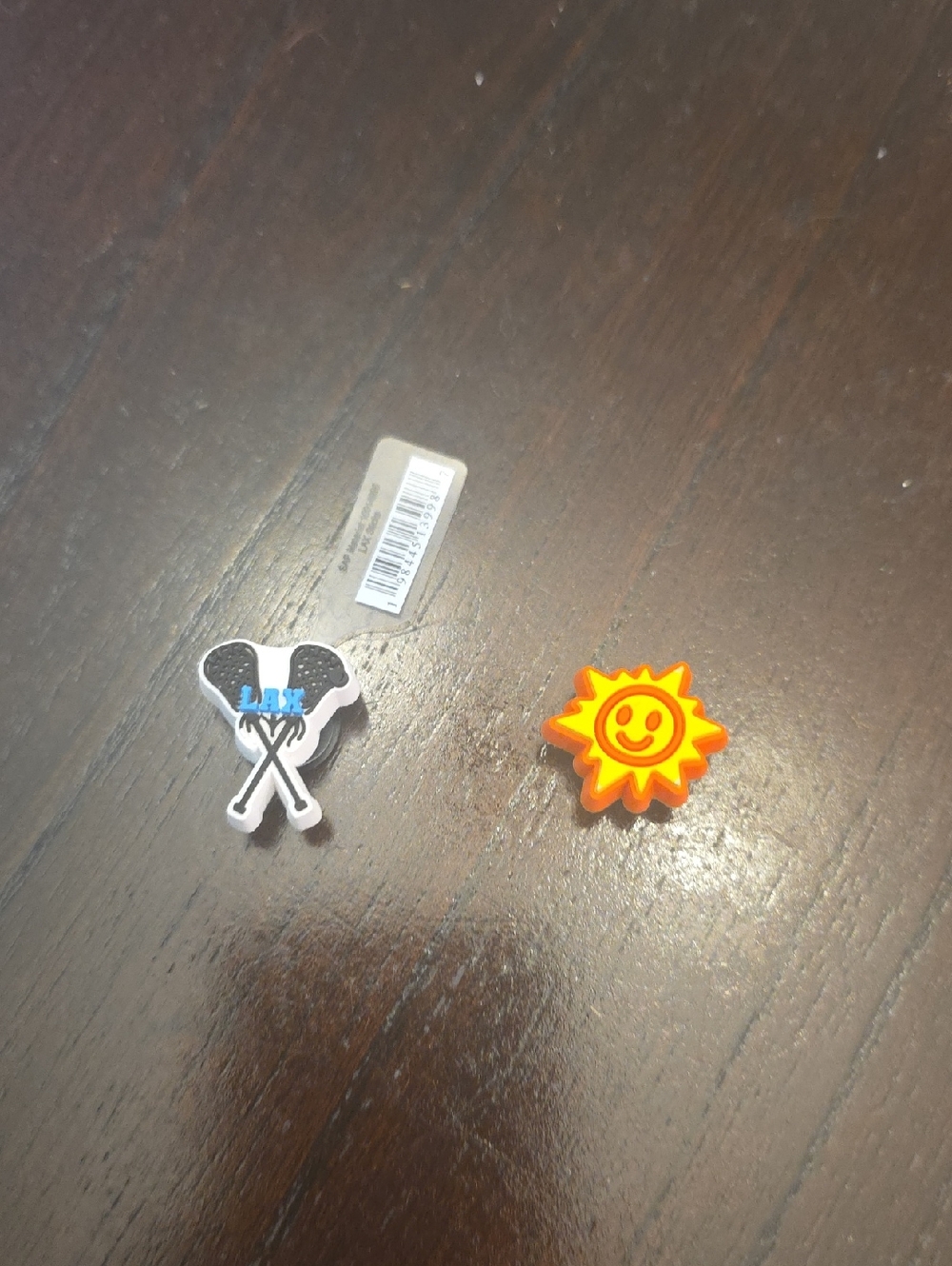 CROCS Orange Smiley Sun & Black Lacrosse Jibbitz Charms